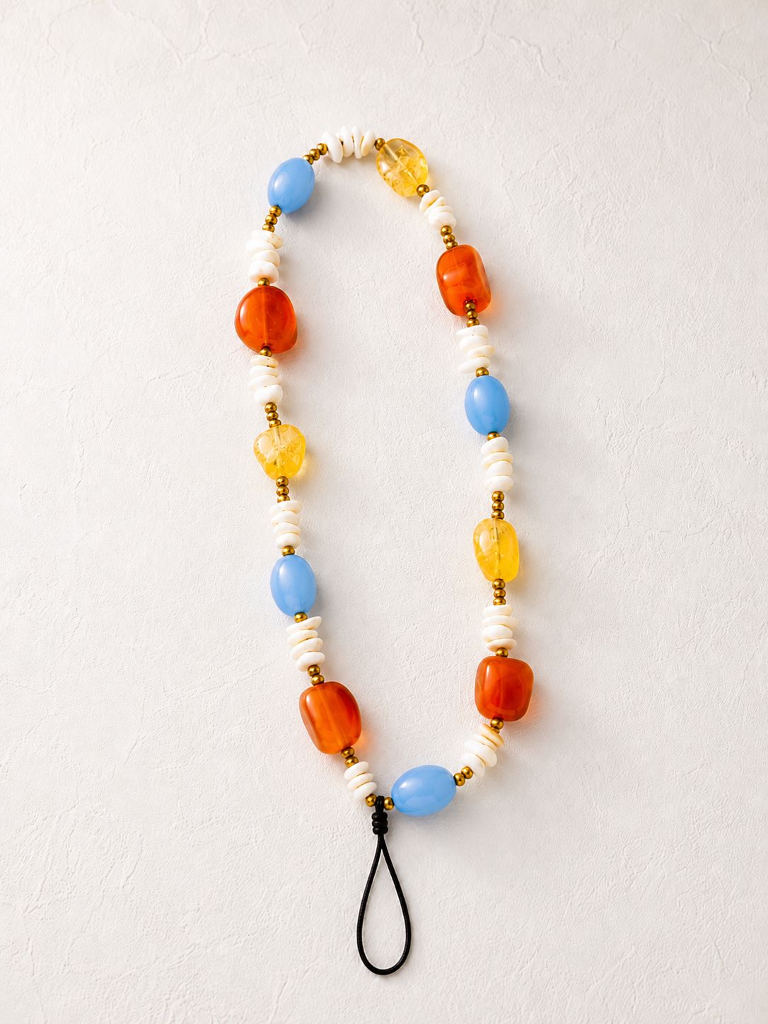 Azure Charm — sky-blue bead and citrus agate phone charm with natural shell details